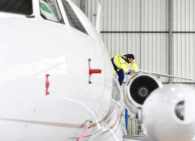 Man on airplane wing