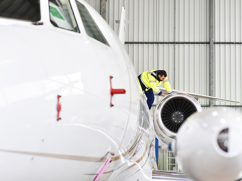 Man on airplane wing