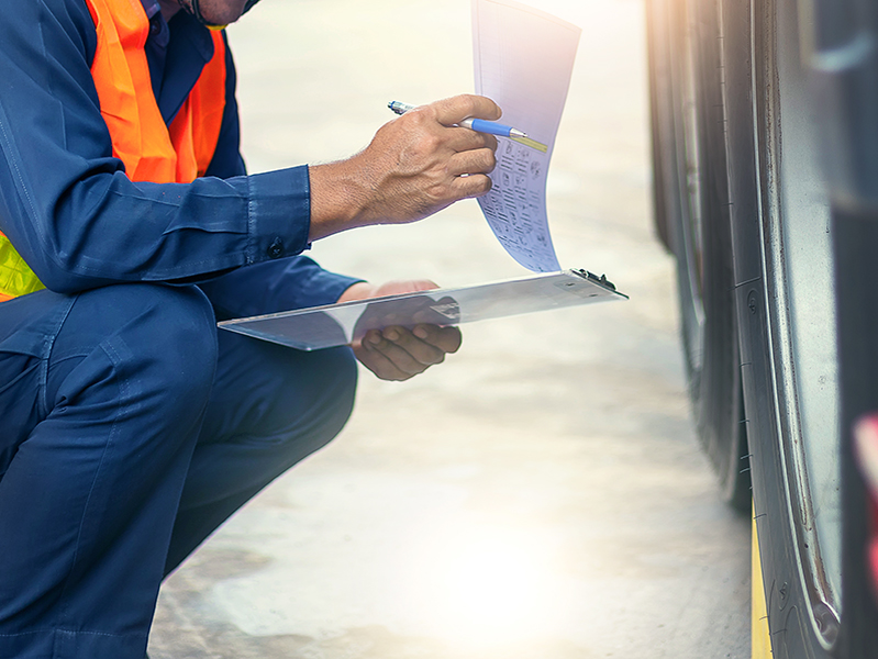 Pre-trip inspection on a truck,