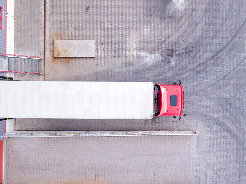 Aerial View of Loading Warehouse with Semi Truck. Aerial